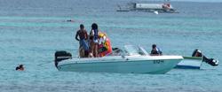 th_380764914_RihannaenjoysafunridewithfriendsonaboatinBarbados_129_122_424lo.jpg